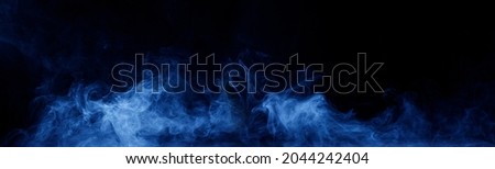 Panoramic view of the abstract fog. White cloudiness, mist or smog moves on black background. Beautiful swirling gray smoke. Mockup for your logo. Wide angle horizontal wallpaper or web banner. Royalty-Free Stock Photo #2044242404