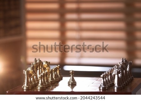 Chessboard with game pieces near window indoors, space for text