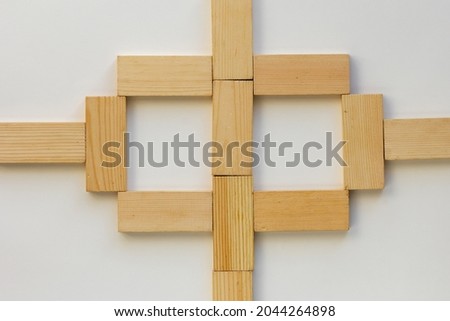 Top view of method how to play with wooden dominoes gaming pieces for children on white background