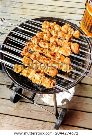 Russian shashlik with skewers on a white plate background in Norway.