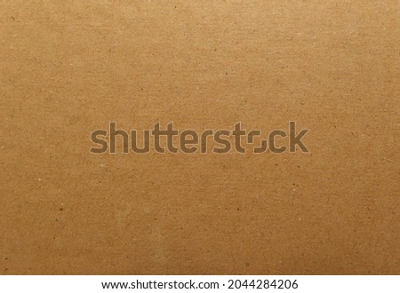 Close up of brown cardboard. It's made from recycled.