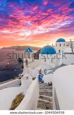 Europe summer destination. Traveling concept, sunset scenic famous landscape of Santorini island, Oia, Greece. Caldera view, colorful clouds, dream cityscape. Vacation panorama, amazing outdoor scene Royalty-Free Stock Photo #2044306958