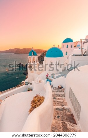 Europe summer destination. Traveling concept, sunset scenic famous landscape of Santorini island, Oia, Greece. Caldera view, colorful clouds, dream cityscape. Vacation panorama, amazing outdoor scene Royalty-Free Stock Photo #2044306979
