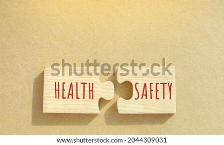 Puzzles with the word Health and Safety. Occupational health and safety systems, protect employees. Safe workplace which uses safe plant and equipment. Successful business concept. Royalty-Free Stock Photo #2044309031