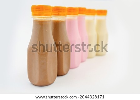 Chocolate, Strawberries and Caramel milk in plastic bottle
