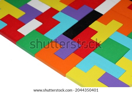 puzzle of geometric shapes of different shapes and colors on a white background