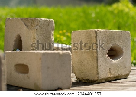 Bricks on a garden table in summer