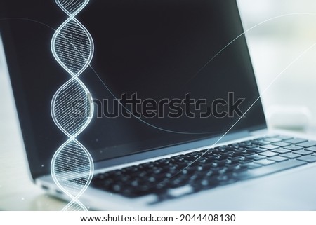 Creative concept with DNA symbol illustration on modern laptop background. Genome research concept. Multiexposure