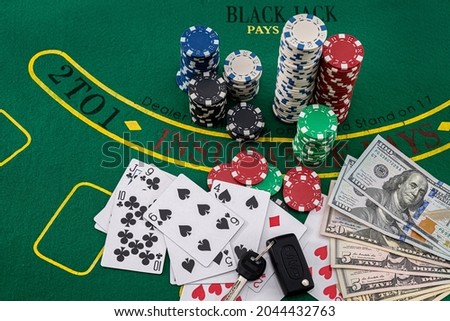 on the poker green table are chips, cards, and car keys. Poker concept