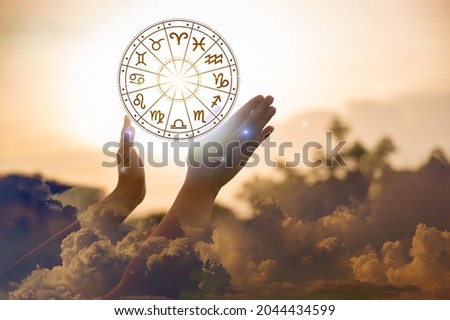 Zodiac signs inside of horoscope circle astrology and horoscopes concept Royalty-Free Stock Photo #2044434599