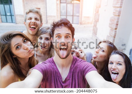 Selfie! teenagers taking pictures in the city Royalty-Free Stock Photo #204448075