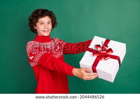 Photo of curly wavy hairdo boy give deliver present wear deer ornament sweater isolated green color background