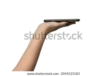 Mobile cell phone with blank black screen in female hand isolated on white background