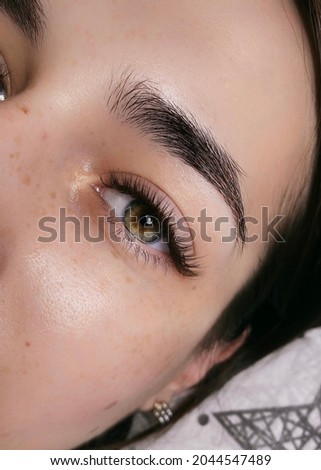
Eyelash extension procedure. Fake lashes Royalty-Free Stock Photo #2044547489