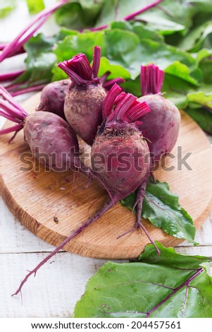 Fresh vegetable beetroots on white wooden background. Selective focus. Rustic style.
