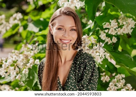 Photo of positive cheerful happy young woman smile spring good mood weekend enjoy outdoors outside park street