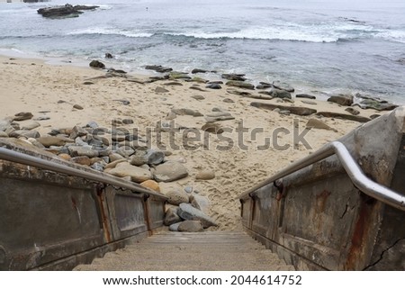 Straight stairs leading to small beach in La Jolla California.