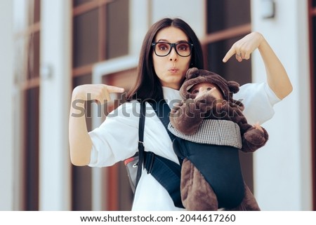 Proud Mom Showing Off her Newborn Infant in Baby Carrier. Happy mommy bragging about her daughter walking together outdoors
 Royalty-Free Stock Photo #2044617260