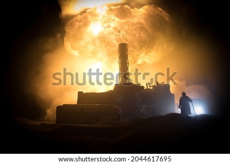 Creative artwork decoration. Chernobyl nuclear power plant at night. Layout of abandoned Chernobyl station after nuclear reactor explosion. Selective focus Royalty-Free Stock Photo #2044617695