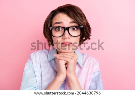 Photo of young woman unhappy sad upset hands touch chin think annoyed isolated over pastel color background