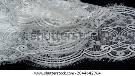 White lace on a black background. Template for wedding invitation and greeting card with lace fabric background