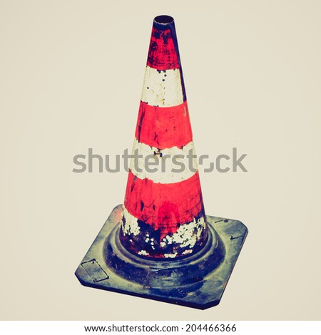 Vintage retro looking Traffic cone for road works isolated over white