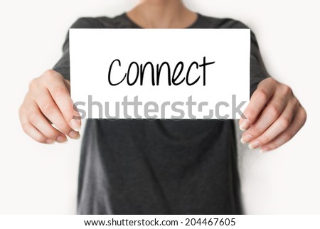 Connect. Female in black shirt showing or holding a card