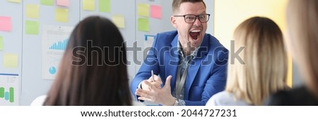 Emotionally screaming business coach conducts employee training. How to resist the rudeness of head Royalty-Free Stock Photo #2044727231