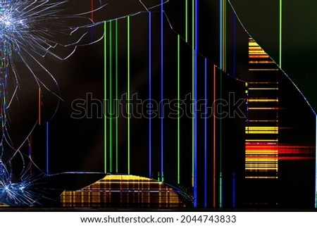 broken tv screen with color bright stripes close up