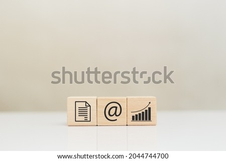 wooden cubes block with business icons document, email and graph. process management working and communications. send online message concept.