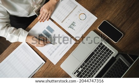 Auditor or internal revenue service staff, Business women checking annual financial statements of company. Audit Concept Royalty-Free Stock Photo #2044747316