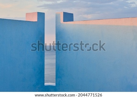 Picturesque geometric building design. Blue facade. Calpe, Spain