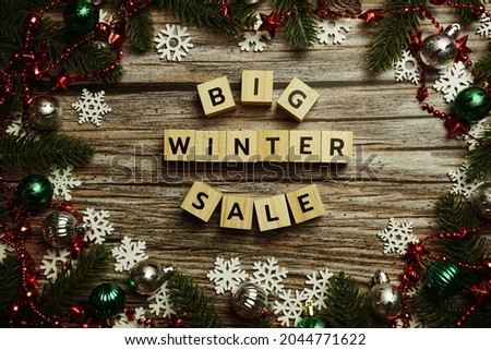 Big Winter Sale alphabet letter on wooden cubes with Christmas Decoration background