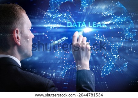Business, Technology, Internet and network concept. Young businessman working on a virtual screen of the future and sees the inscription: Data leak