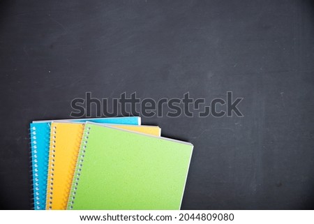 Education, back to school concept. School supplies on blackboard with copy space.