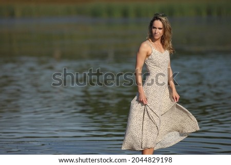 woman in the water in a dress