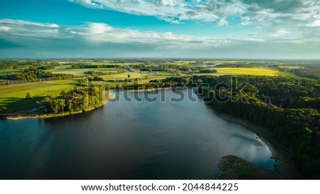 Aerial view of blue lakes and green forests on a sunny summer day in Poland. drone photography.