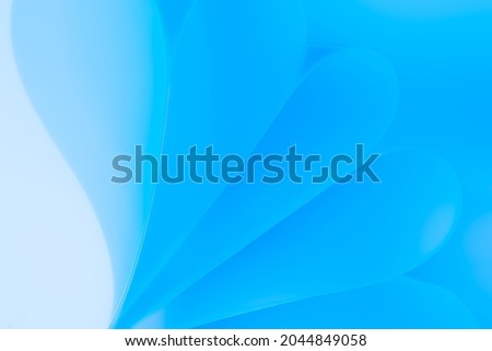 Wavy abstract structure made of paper sheets. Blue background.
