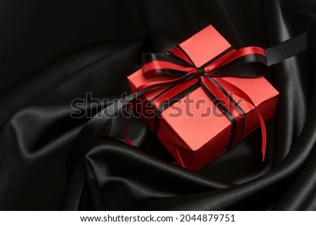 Black friday sale concept with gift box with ribbon, close-up