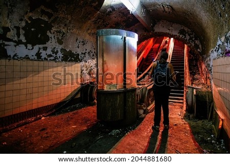 Dark and creepy old abandoned subway station. Broken escalator. Royalty-Free Stock Photo #2044881680