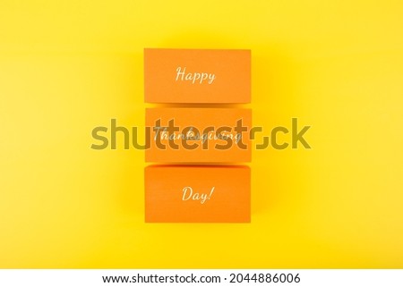 Colorful Happy Thanksgiving day minimal concept in red and orange colors. Template for greeting card or poster