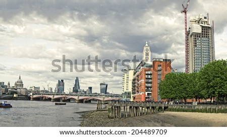 Skyline of City of London with Blackfriars Bridge over River Thames.