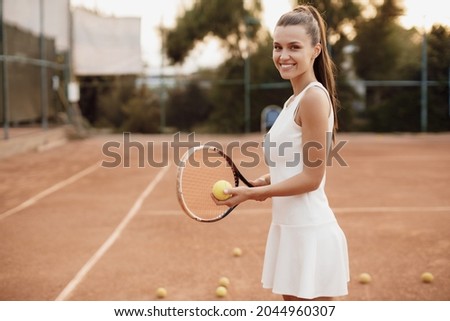 Young woman tennis player with racket