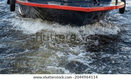 the bow of the boat. it goes at a high speed. splashes from the wave. a yacht in motion on a walk on the water