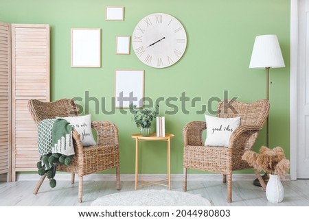 Interior of modern room with wicker chairs