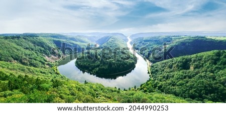 panoramic of Saarschleife - Saar river loop in Saarland, Germany. landmarks, travel guide and postcard. landscape banner Royalty-Free Stock Photo #2044990253