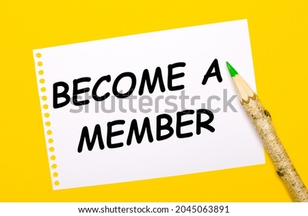 On a bright yellow background, a large wooden pencil and a white sheet of paper with the text BECOME A MEMBER