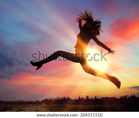 Silhouette of jumping girl