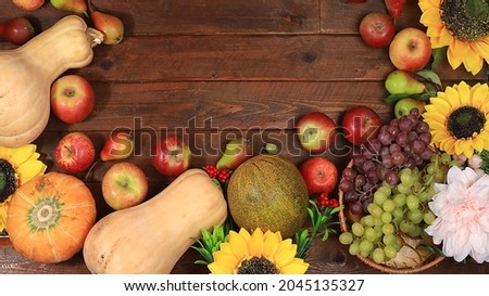 Happy Thanksgiving concept, autumn background with seasonal fall nature berries, pumpkins, melons, apples, grapes and flowers on wooden background, top view, copy space, flat lay. , selective focus.