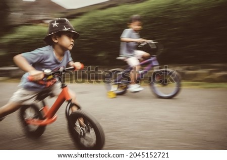 motion blur, face of a boy on his bicycle